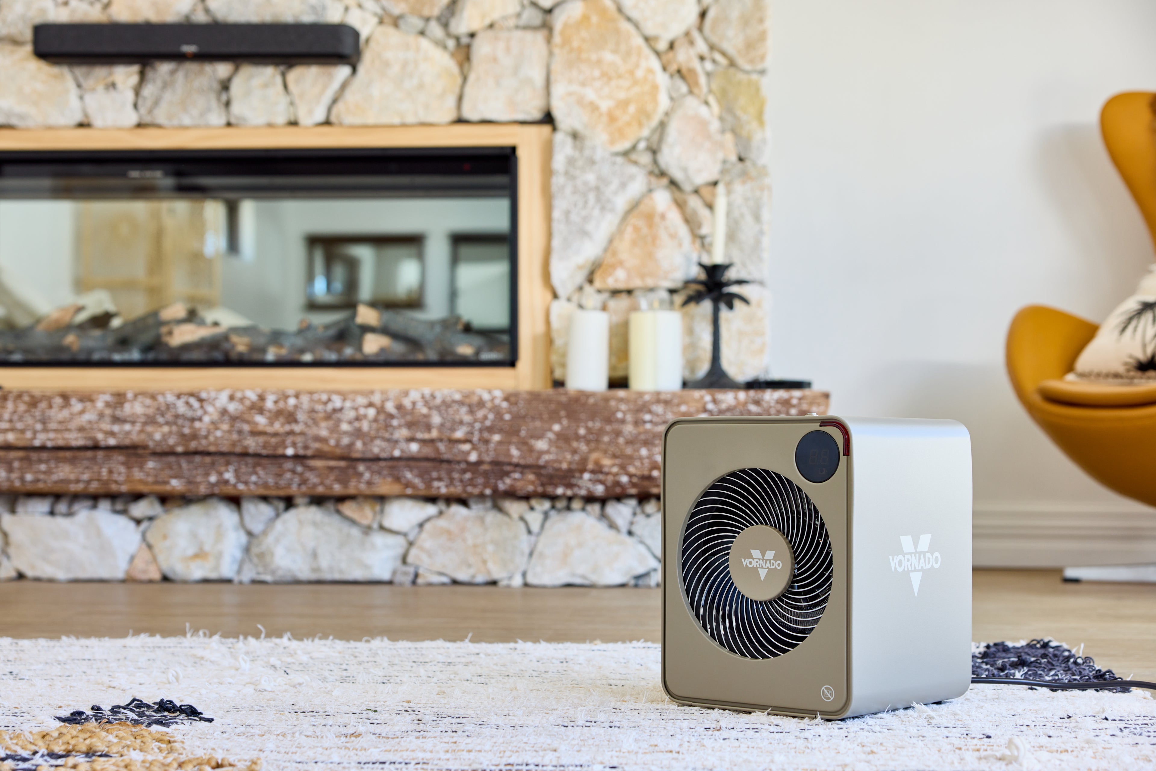 Vornado Heater on a rug in front of a stone fireplace