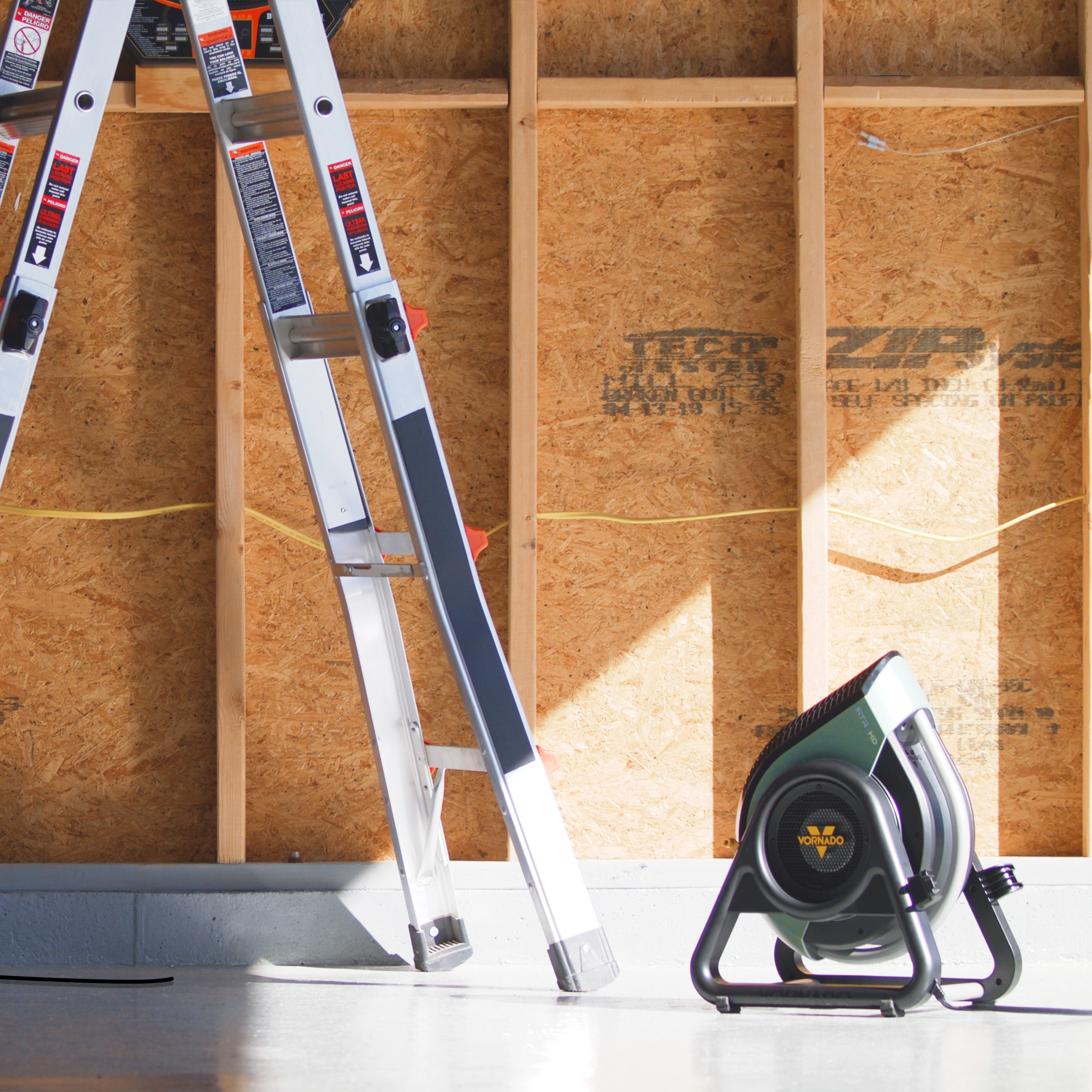 RTR HD Heavy Duty Air Circulator on floor in front of a ladder.